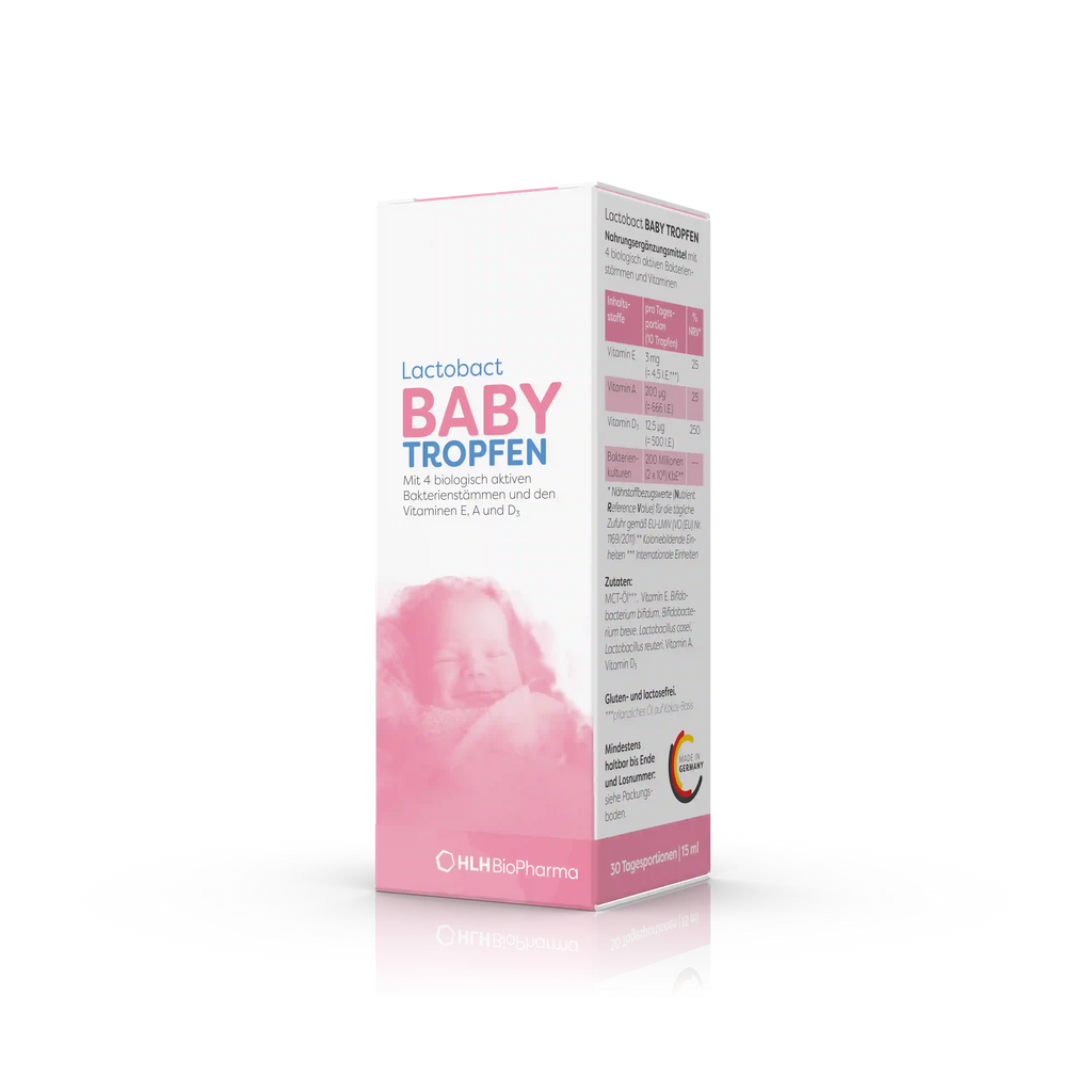 Produktbild schräge Ansicht von Lactobact BABY TROPFEN mit einem schlafendem Baby auf der rosafarbenen Verpackung.